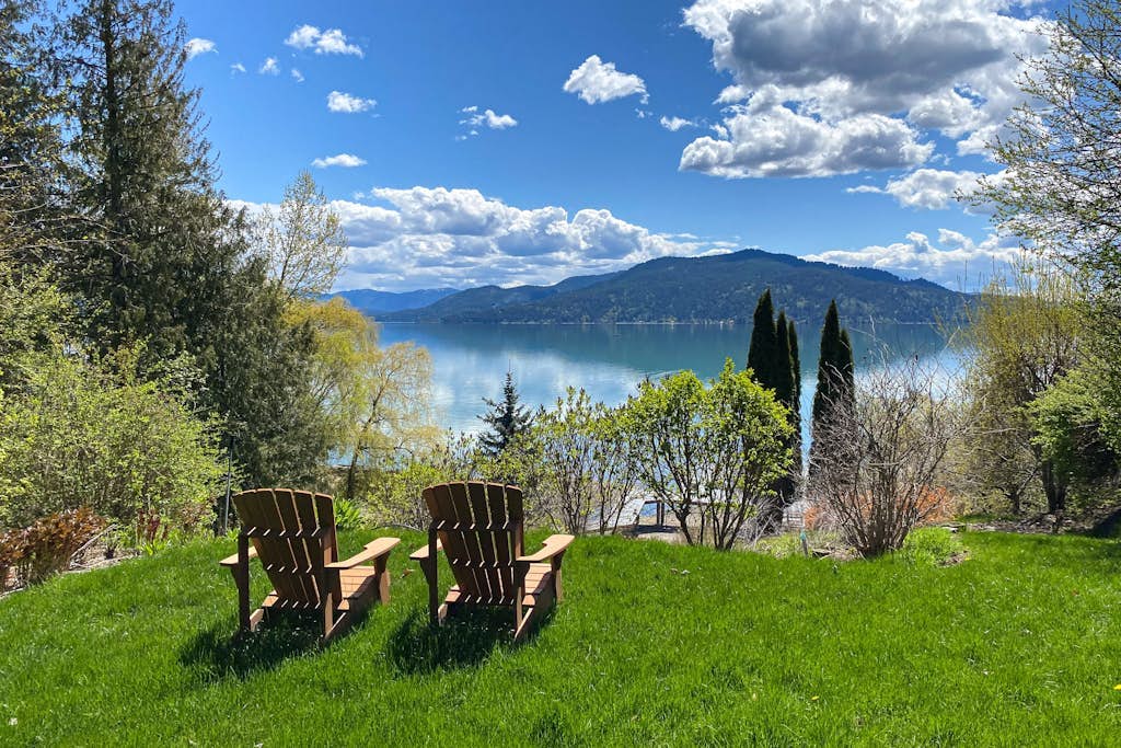 Lakefront home with mtn views, private hot tub, dock, deck, & grill