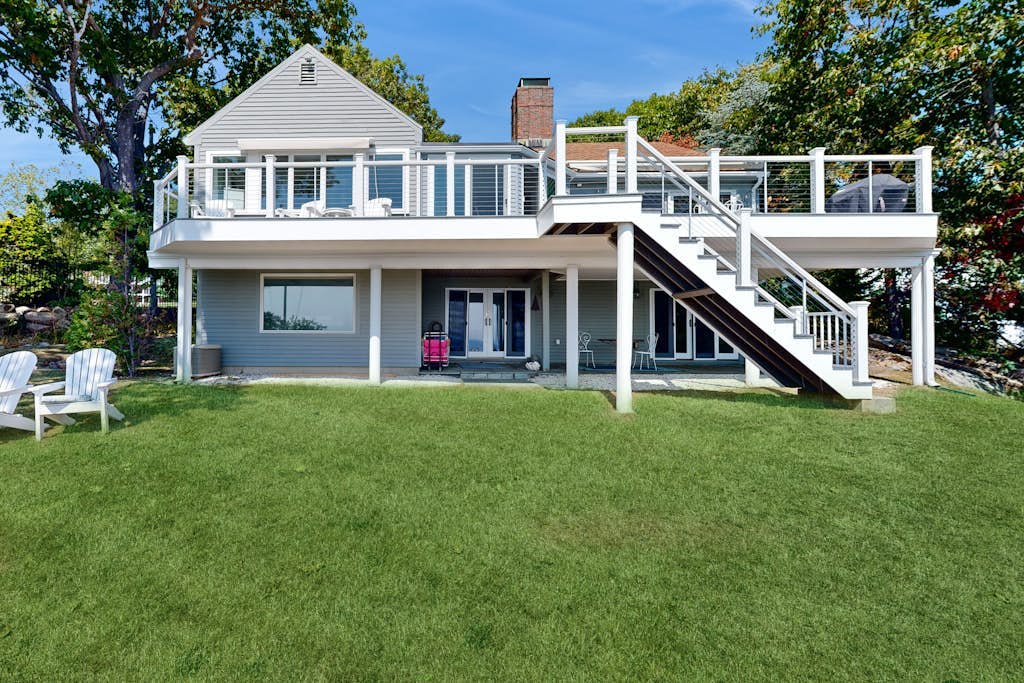 Modern oceanfront home with scenic deck, grill, games, chef's kitchen, & W/D