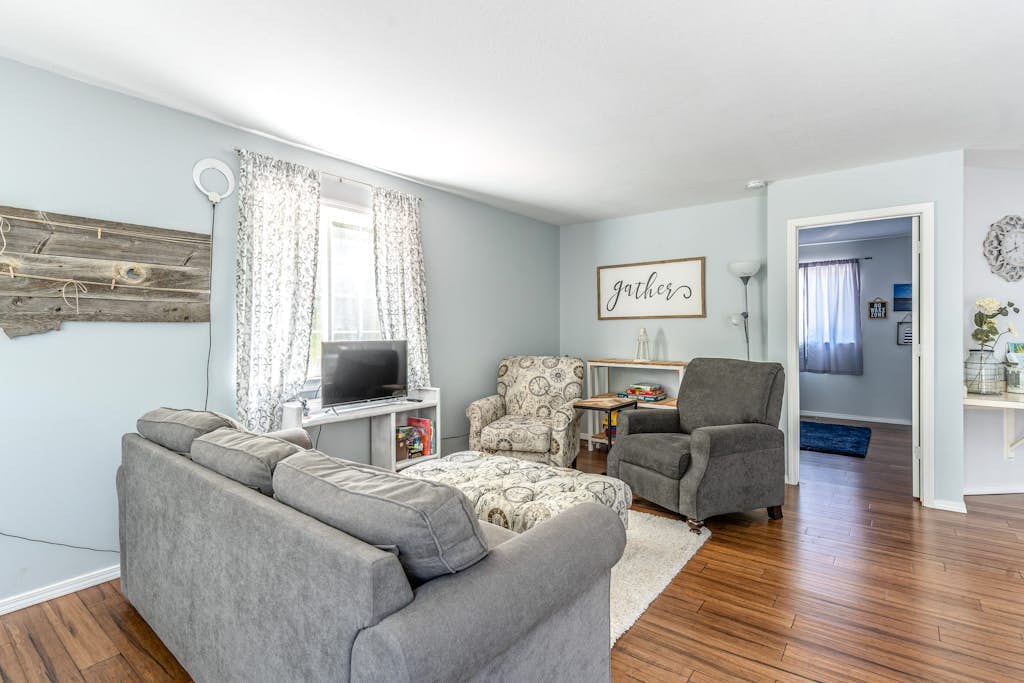 Mountain-view home with large deck, gas grill, firepit, lawn, and central AC