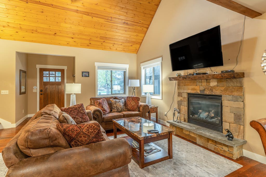 Golf resort home with fairway views, hot tub, sauna, covered deck, & grill