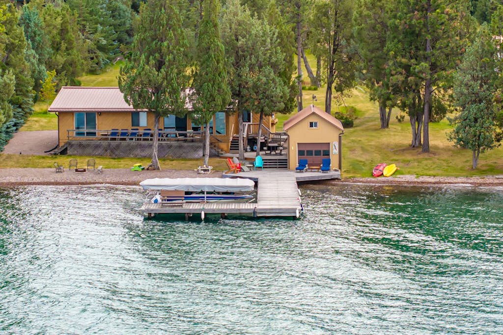 Lakefront home with private beach, dock, firepit, & grill - dazzling sunset view