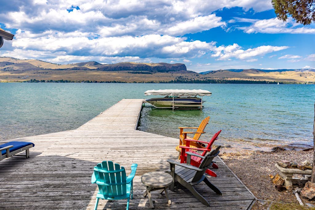 Lakefront home with private beach, dock, firepit, & grill - dazzling sunset view