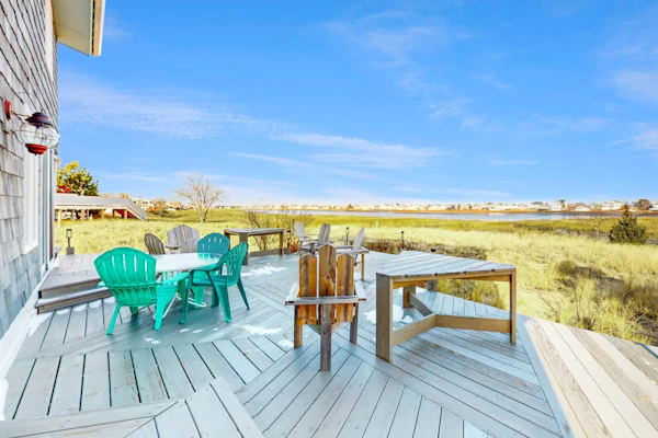 Two-story riverfront retreat with a furnished deck, views, & washer/dryer