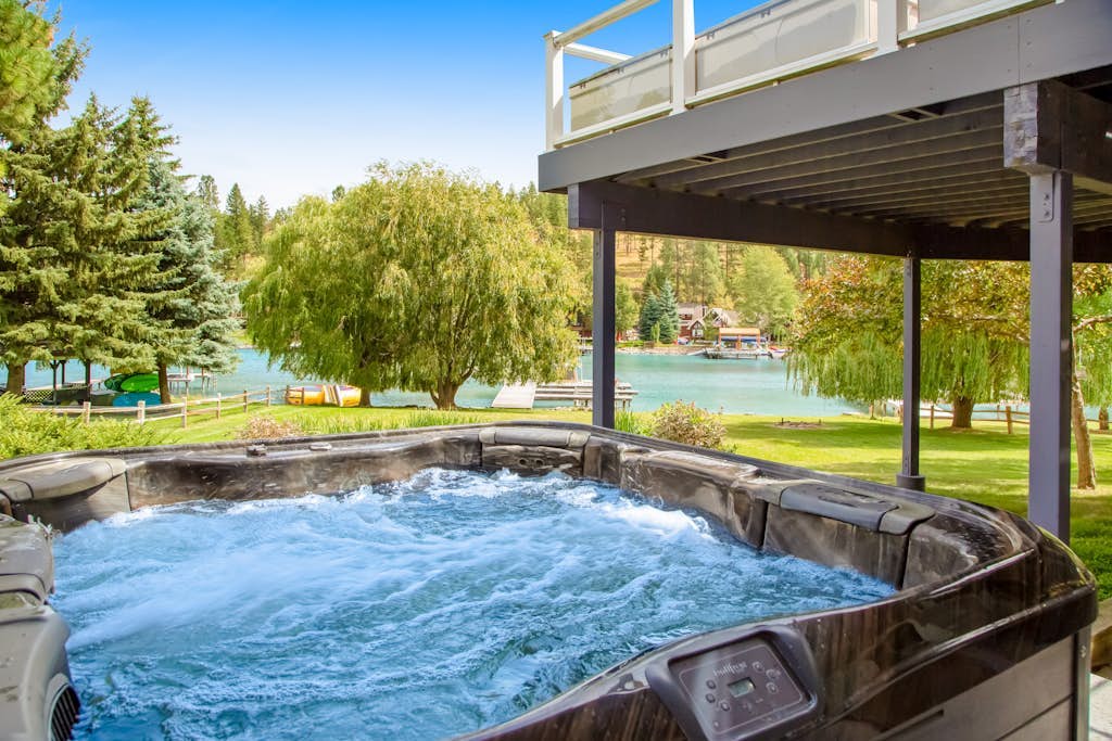 Lakefront home with dock, lake views, Ping-Pong, outdoor kitchen, private beach