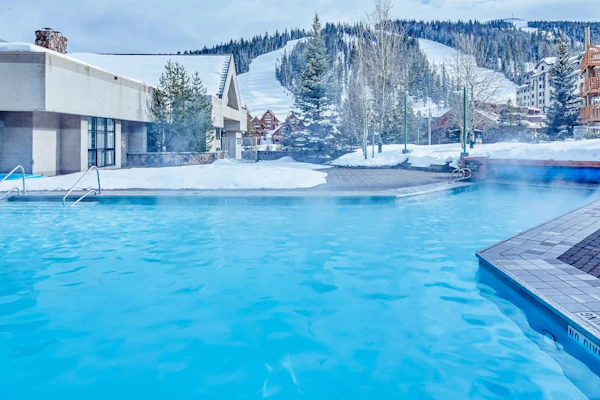 Ski-in/out, mountain-view condo with hot tub, pool & gym