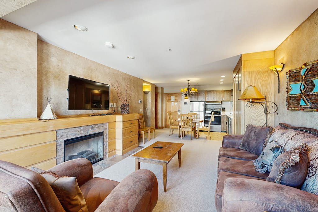 Ski-in/out condo with mountain views, pool, hot tub, sauna, gym & fireplace