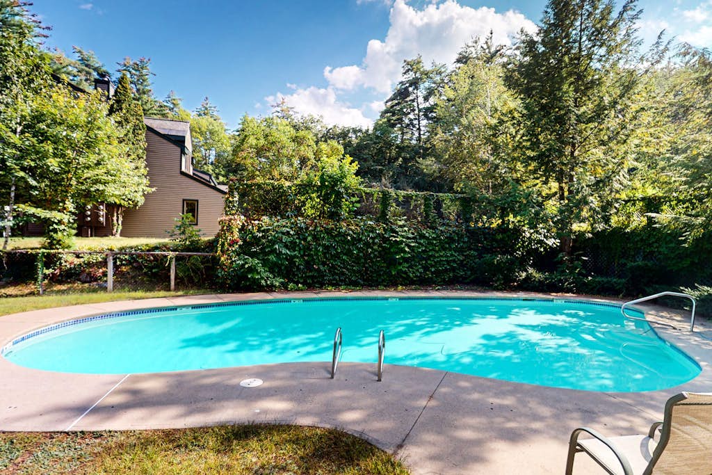Lakefront condo with on-site pool, dock, swimming, firepit, & tennis