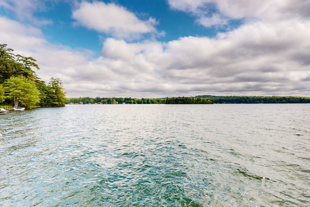Dog-friendly lakefront home with dock, fireplace, firepit, lake views, & 1 kayak