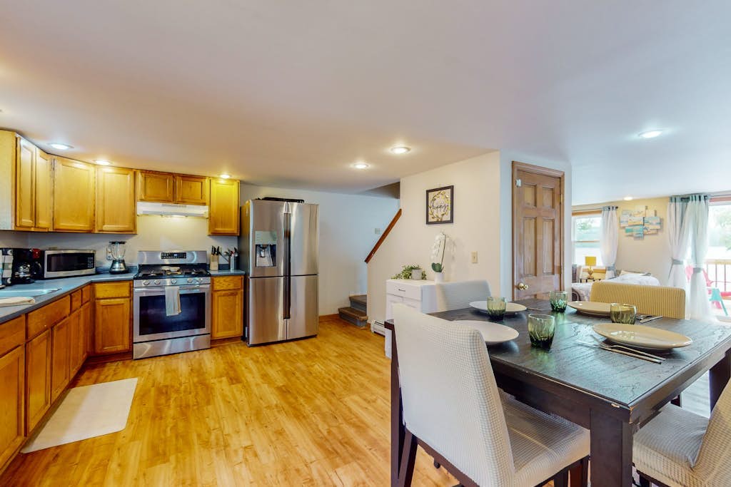 Dog-friendly lakefront home with dock, fireplace, firepit, lake views, & 1 kayak