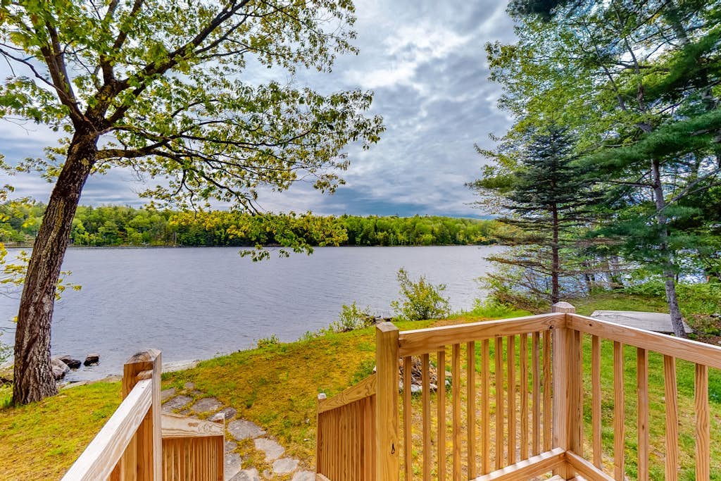 Lakefront cabin with private dock, wood stove, firepit, deck, & grill - 1 dog ok
