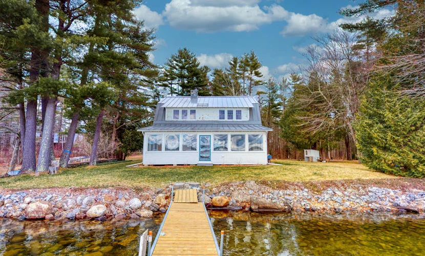 Lakefront home with private dock, kayaks, firepit, grill, & sunroom