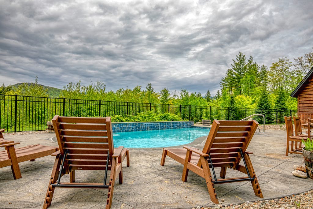 Elegant mountain-view home with private hot tub, saltwater pool & foosball