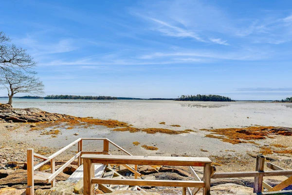 Waterfront home with furnished deck, ocean views, & full kitchen