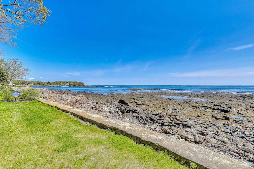 Inviting oceanfront home with fireplace, firepit, & views from every room