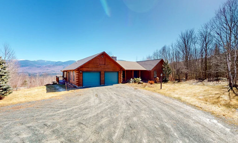 Custom log home with enormous deck & stunning mountain views
