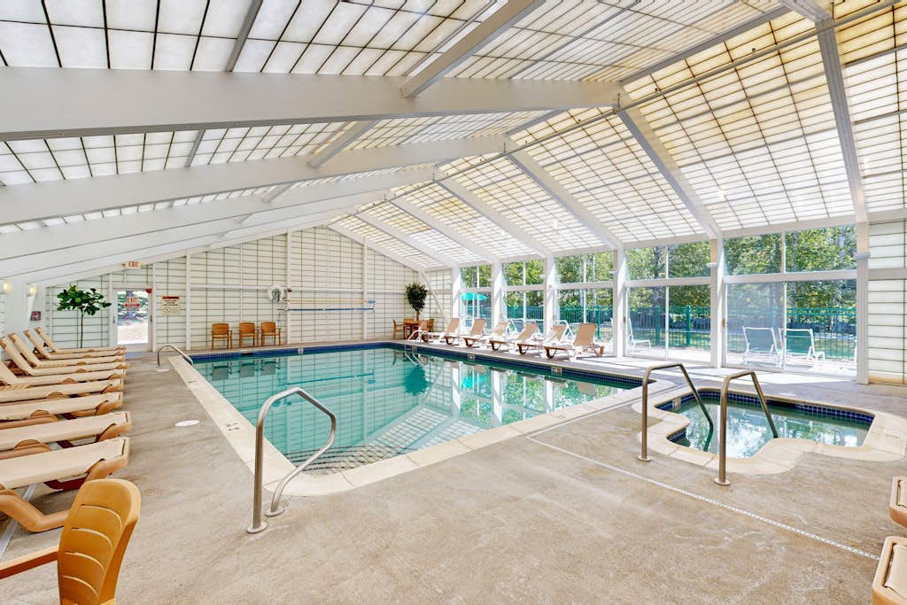 Mountainside condo w/ pool & rec room:  walk to ski lifts & town