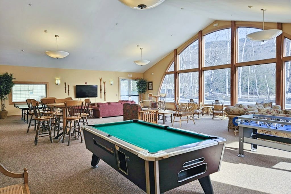 Mountainside condo w/ pool & rec room:  walk to ski lifts & town