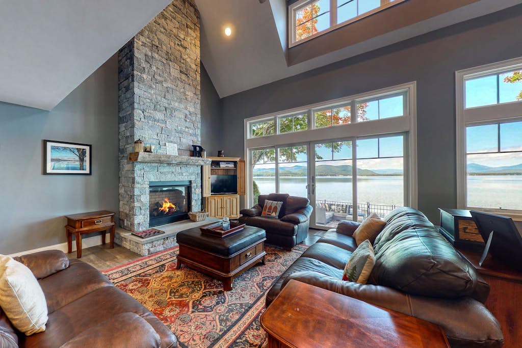 Dog-friendly lakefront home with lake views, firepit, dock, patio, & grill