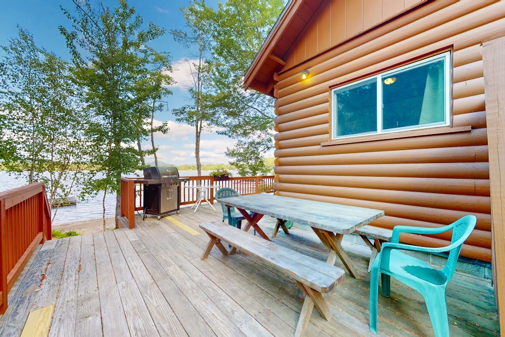 Lakeside home with private dock, firepit, grill, scenic balcony, fireplace & AC