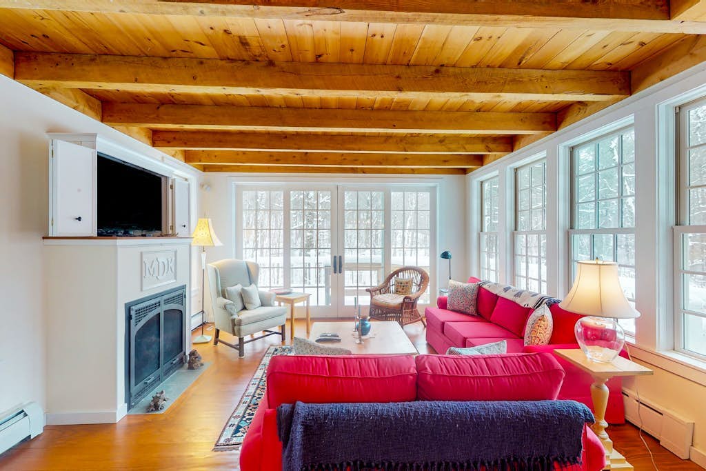 Picturesque creekside home with gorgeous deck & sunroom, near 4 ski mountains