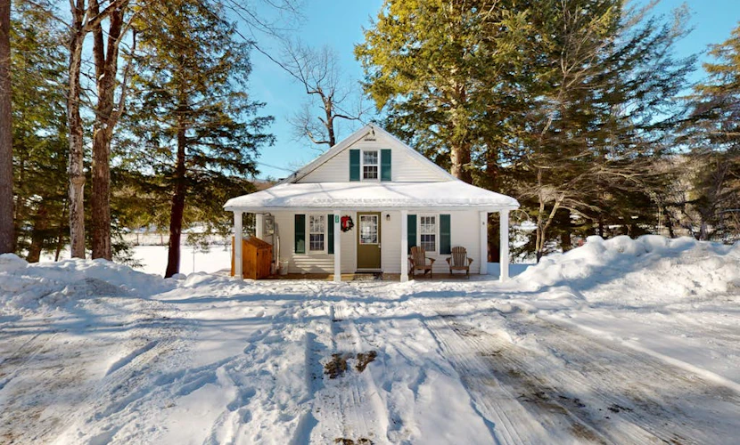 Quaint lakefront home with a fire pit and beautiful views