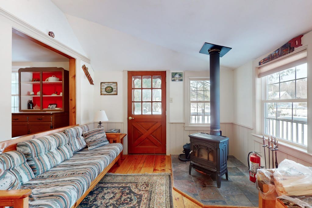 Quaint lakefront home with a fire pit and beautiful views