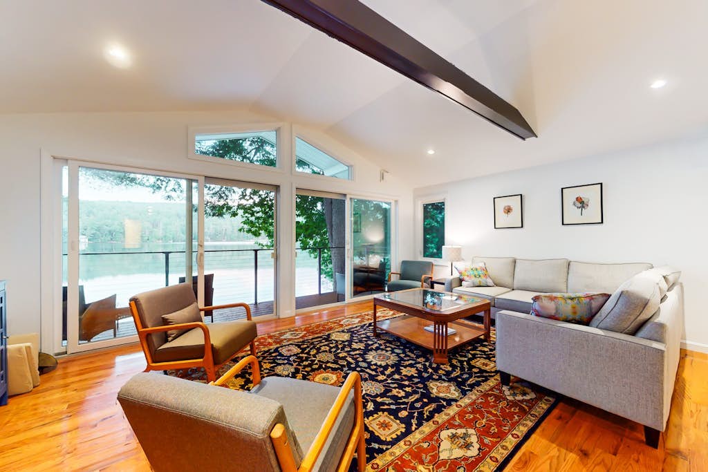 Renovated lakefront cottage w/ hot tub, dock, kayaks, swim platform, & firepit