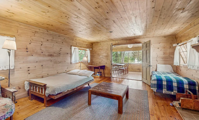 Classic lakefront cabin w/ screened-in porch & mountain views - dogs-friendly