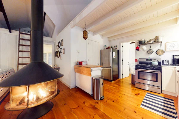 Cottage in the woods with a firepit, grill, washer/dryer, & AC - dog-friendly