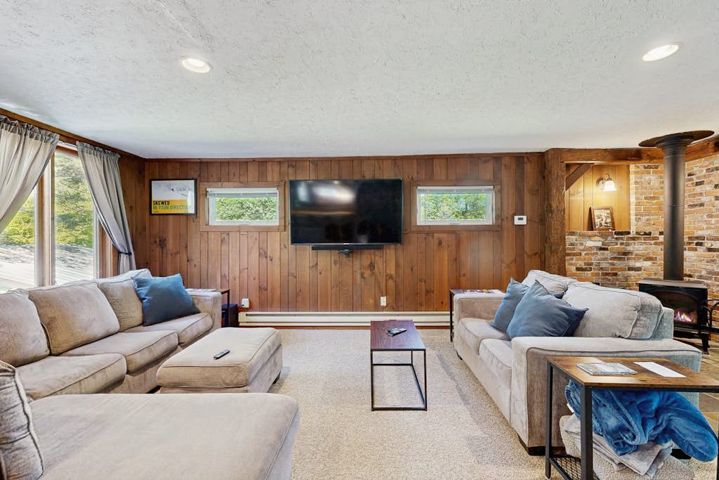 Inviting riverfront home with hot tub on deck & fireplace, near skiing & golf