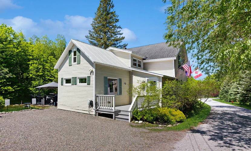 Inviting riverfront home with hot tub on deck & fireplace, near skiing & golf