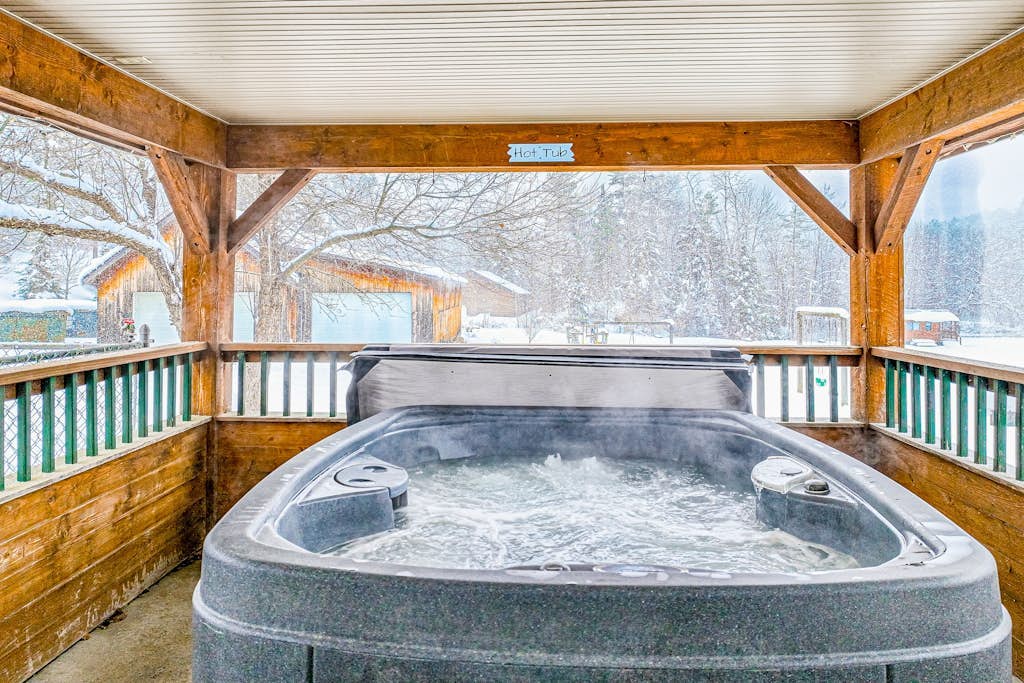 Dog-friendly, mountain-view cabin with shared hot tub, fireplace, & central AC