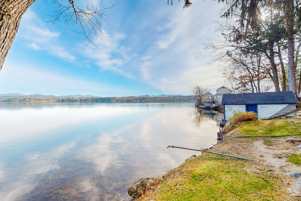 Dog-friendly cabin on the water with a sunroom, firepit, & full kitchen
