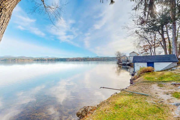 Dog-friendly cabin on the water with a sunroom, firepit, & full kitchen