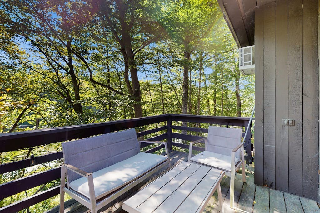 Cozy condo w/ balcony, river view, electric woodstove, w/d, wifi, kitchen, a/c