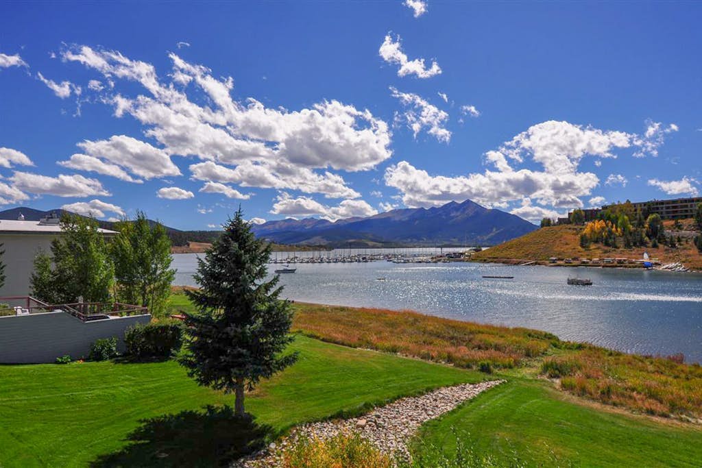Lakefront retreat with mountain views, covered parking & updated interiors