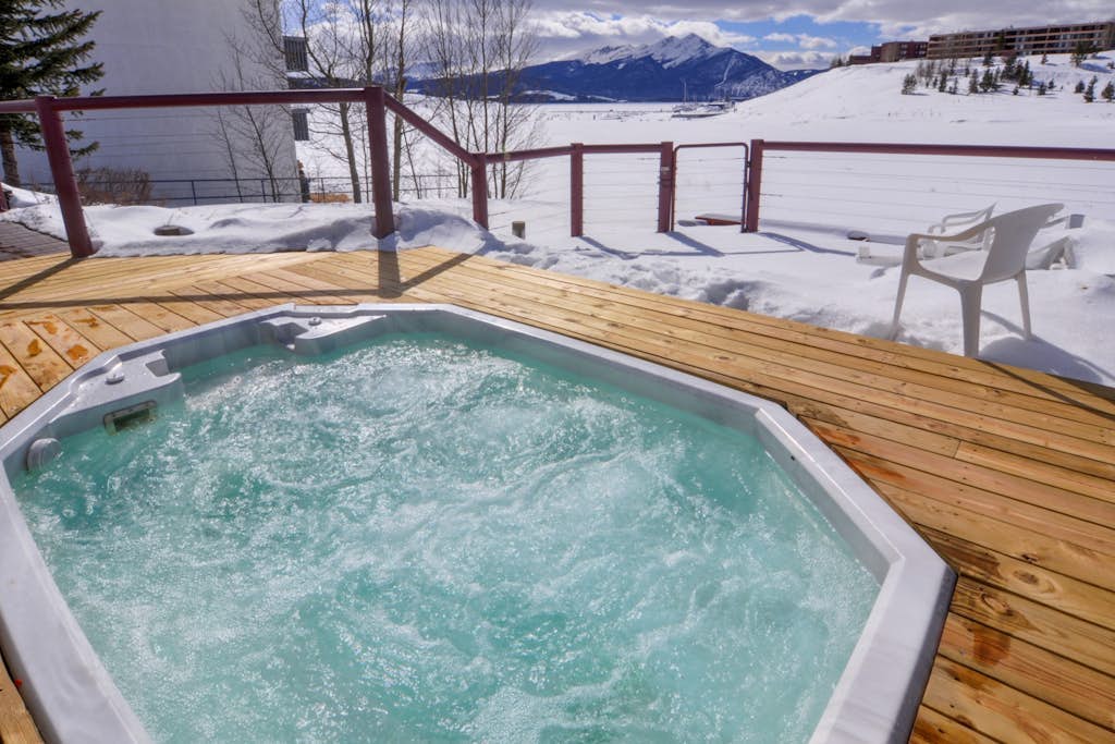 Lakefront retreat with mountain views, covered parking & updated interiors