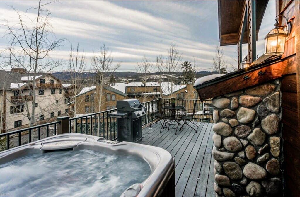 Lodge-like townhome with hot tub, deck, mountain views & heated garage