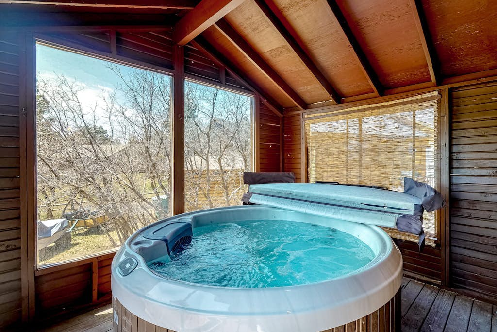 Dog-friendly home with indoor hot tub, fireplace, great views & pool access