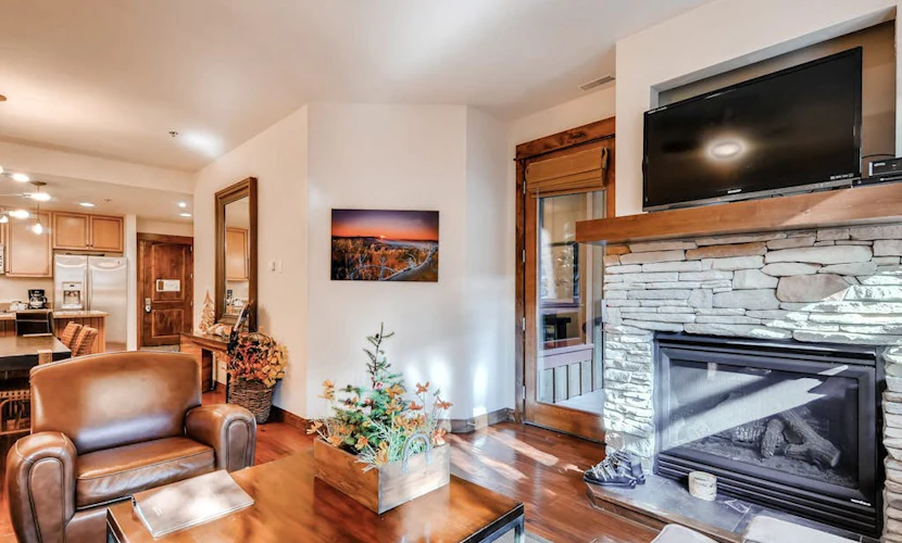 Breckenridge villa with open layout, fireplace, hot tub, & resort amenities