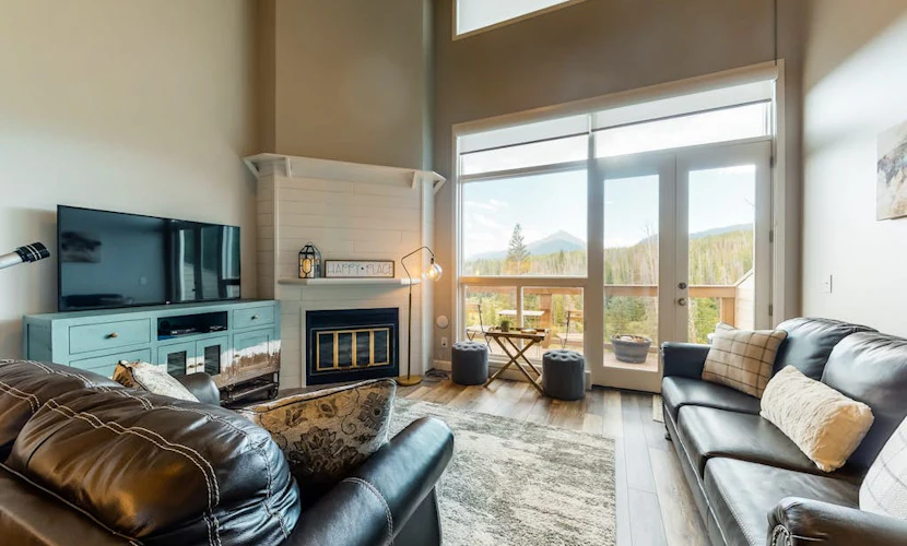 Modern condo with mountain views from balcony and gas fireplace