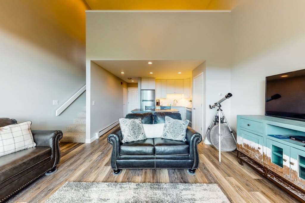 Modern condo with mountain views from balcony and gas fireplace