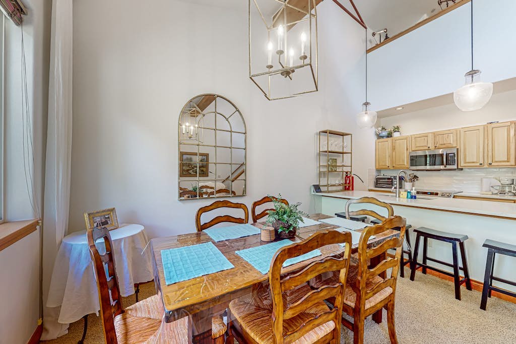 Two-story, riverfront condo with balcony & fireplace - close to everything