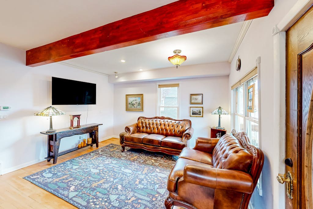 Restored downtown home with front porch, mountain views, & washer/dryer