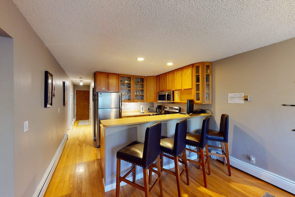 Ski slope-view condo on Gore Creek with fireplace - walk to Vail Village