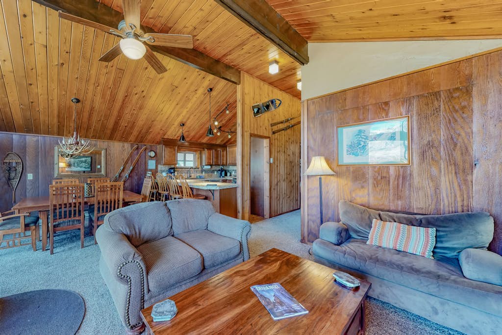Ski-in/ski-out condo with lake and mountain views, woodstove