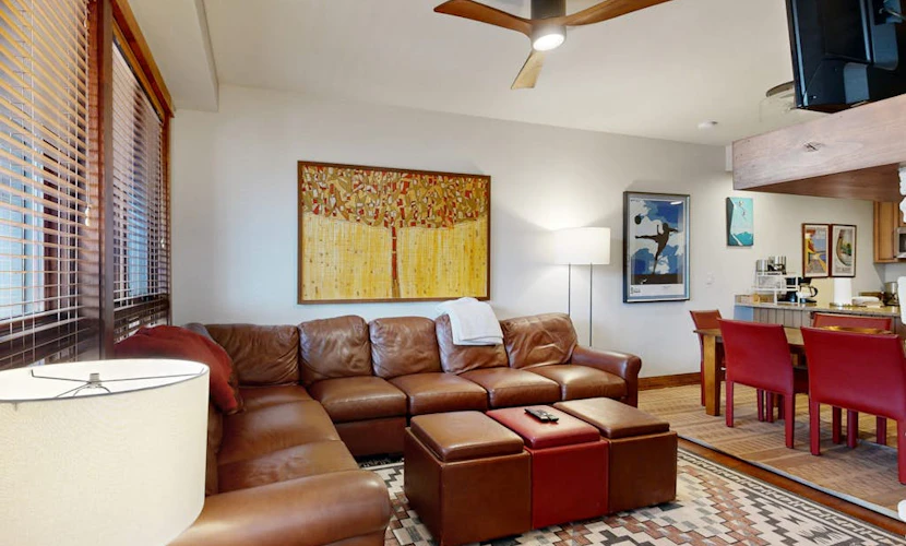 Inviting mountain view condo with pool, hot tub, ski lifts nearby, & fireplace