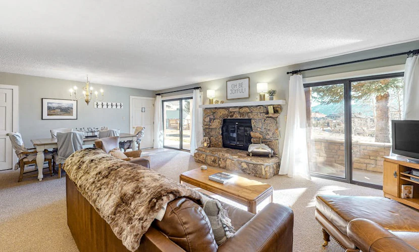 Mountain-view condo with private deck, fireplace & hot tub