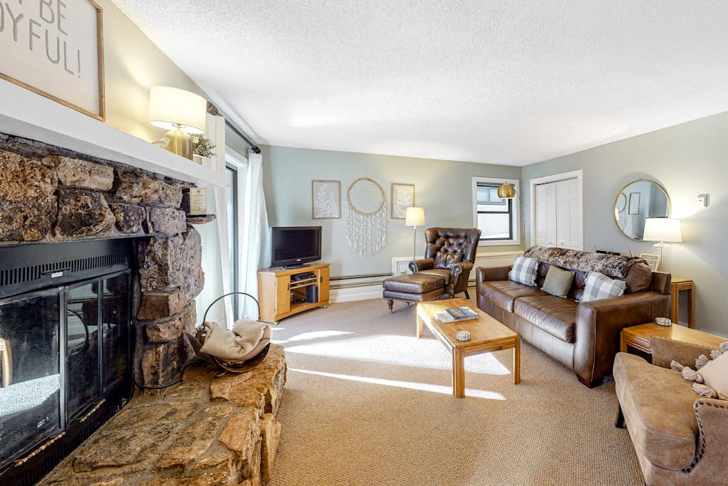 Mountain-view condo with private deck, fireplace & hot tub