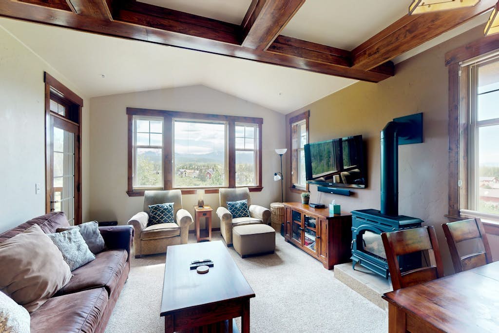Mountain-view condo on ski shuttle route with deck & fireplace